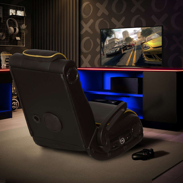 Gaming chair in a room with a TV displaying a racing game