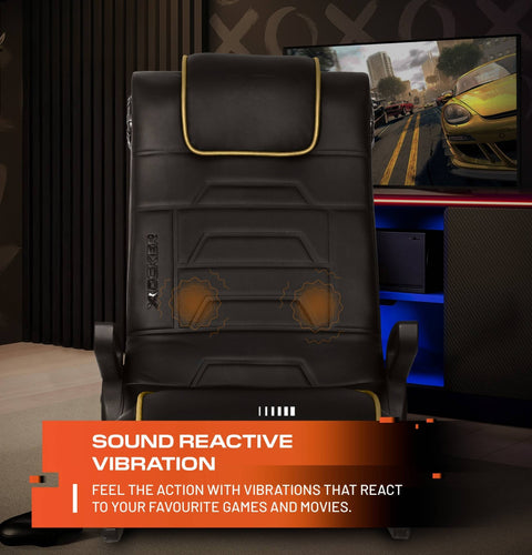 Black gaming chair with sound reactive vibration feature in a gaming setup.