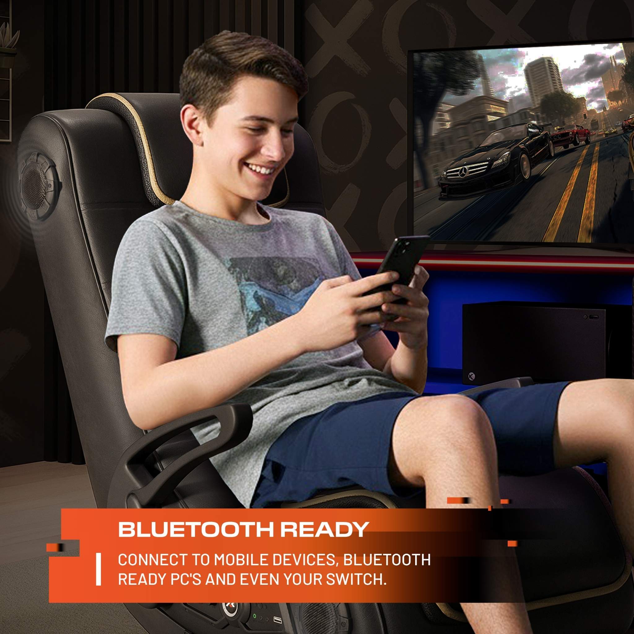 Person playing video games on a console with a gaming chair and TV in the background.