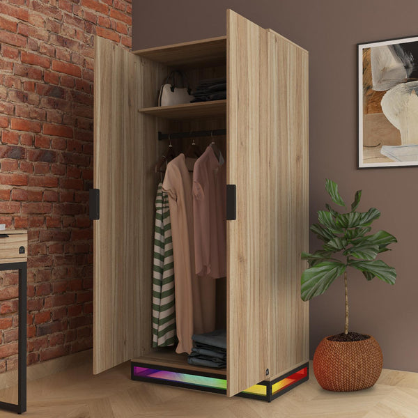 Wooden wardrobe with open doors in a room with a brick wall and plant.