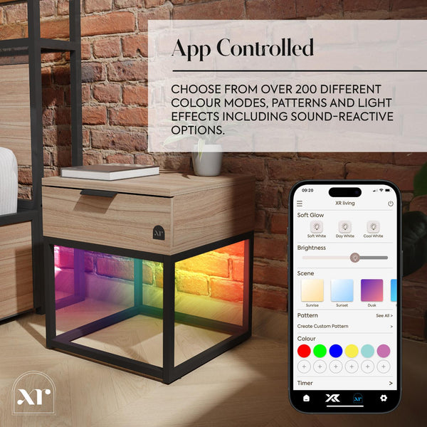 App-controlled lighting cube with smartphone app interface on a wooden surface.