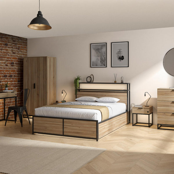 Modern bedroom with wooden bed, desk, and wardrobe against a brick wall.