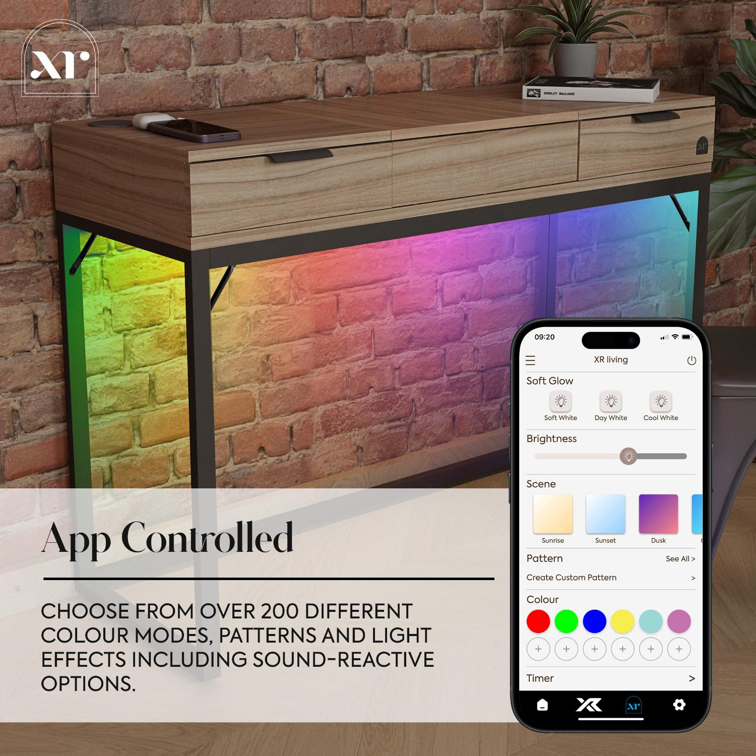App-controlled LED strip light with smartphone app interface on a wooden console table against a brick wall.