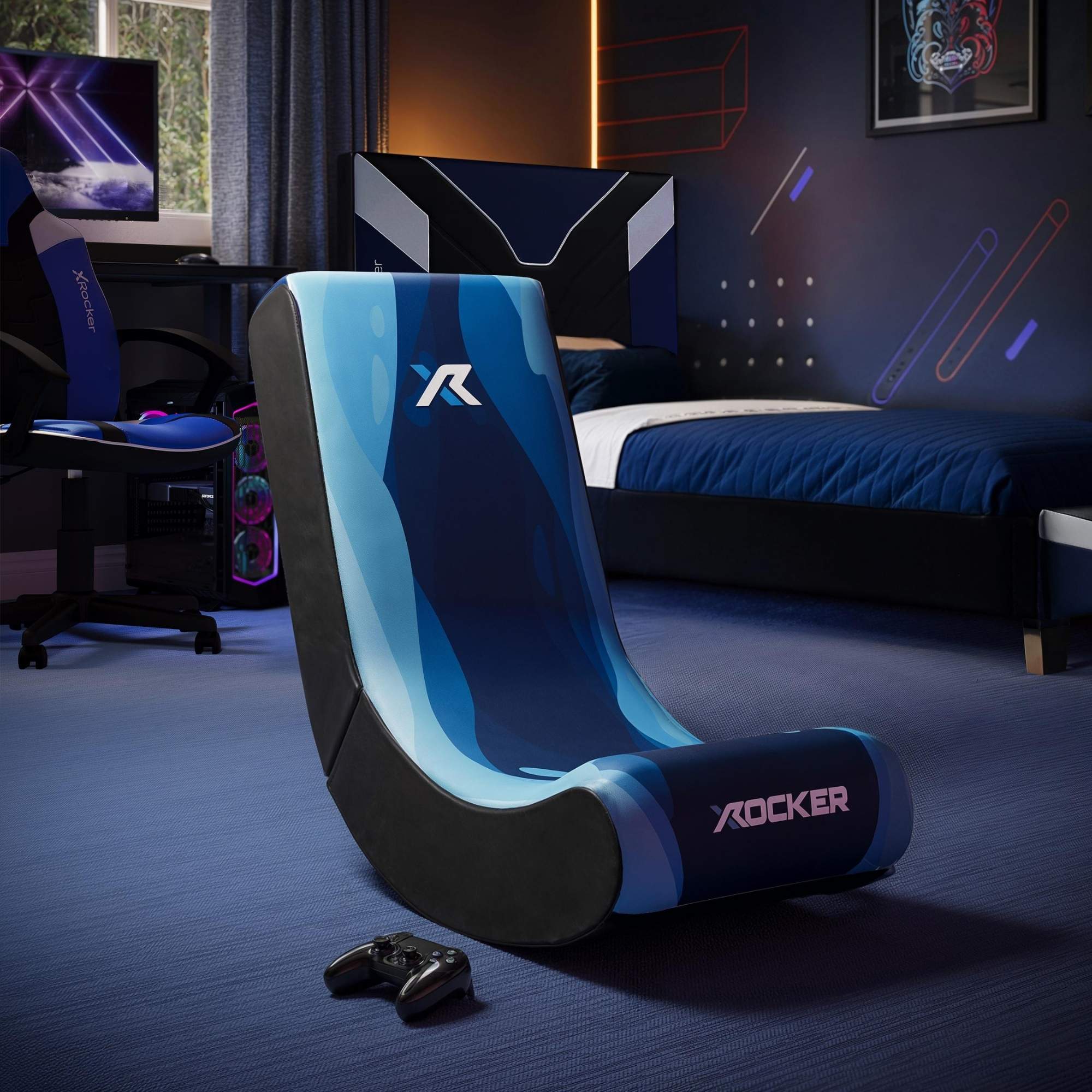 Blue and black gaming chair with X rocker logo in a room setting