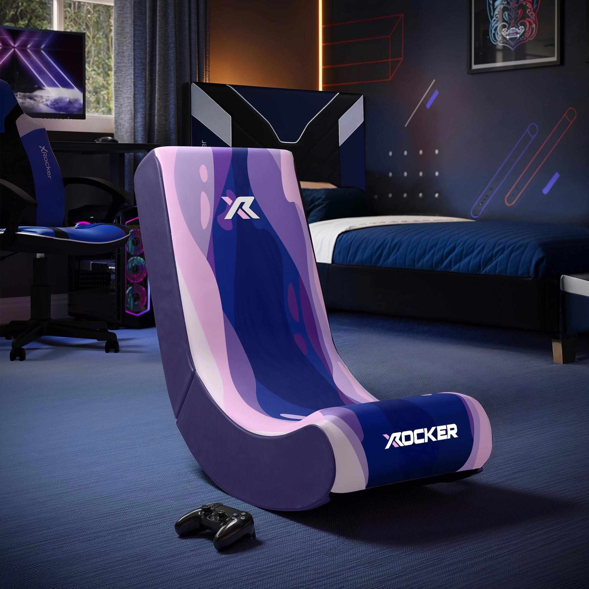 Gaming chair with X rocker logo in a room setup with gaming equipment.