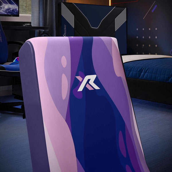 Gaming chair with the 'X Rocker' logo in a room setup