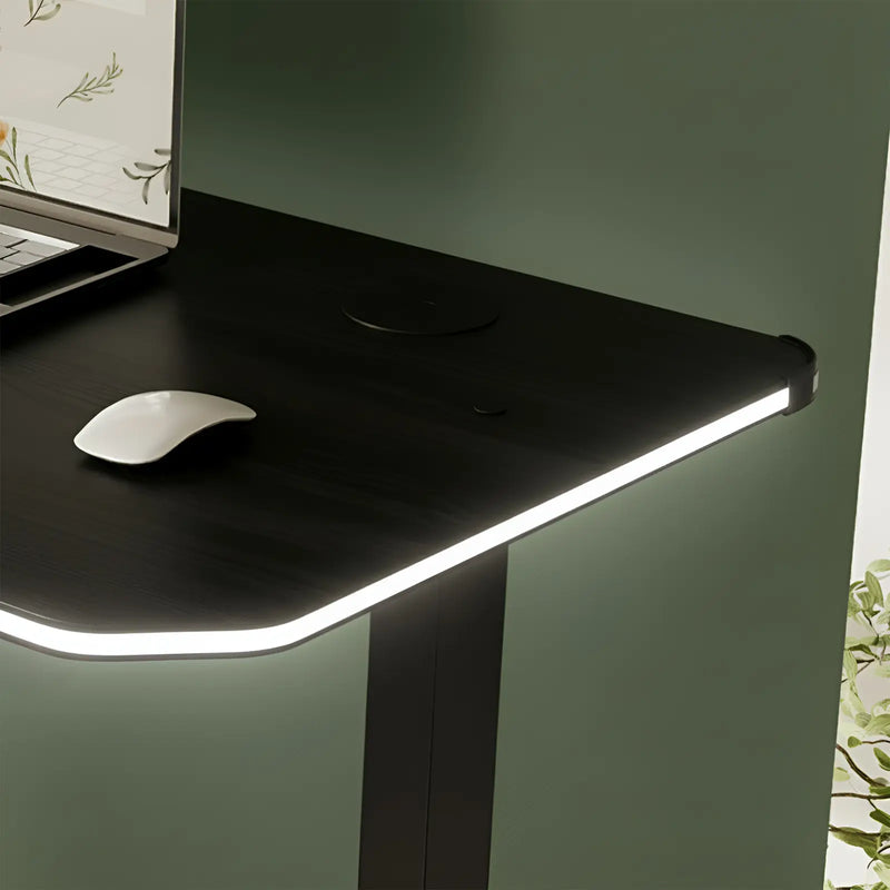 Black wood desk with a computer mouse on a green wall background