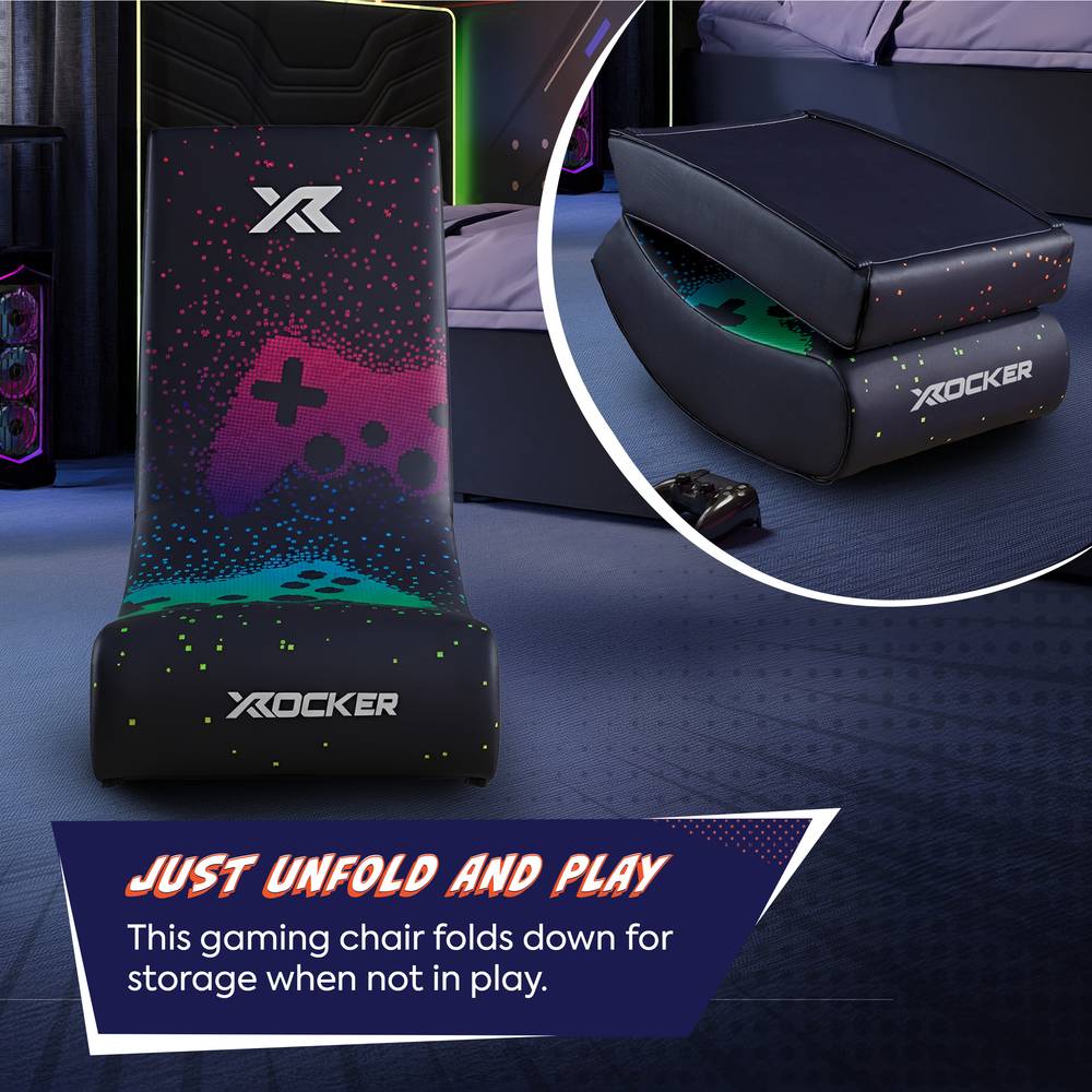 Gaming chair with X rocker logo on a dark surface, showing text 'Just unfold and play'.