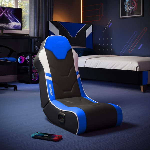 Gaming chair with blue accents in a room setup for gaming.