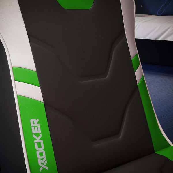 Close-up of a gaming chair seat with green and white accents and 'X rocker' branding.