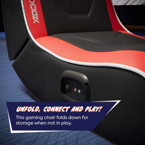 Gaming chair with red and black design, featuring the brand 'X Rocker', on a blue surface.